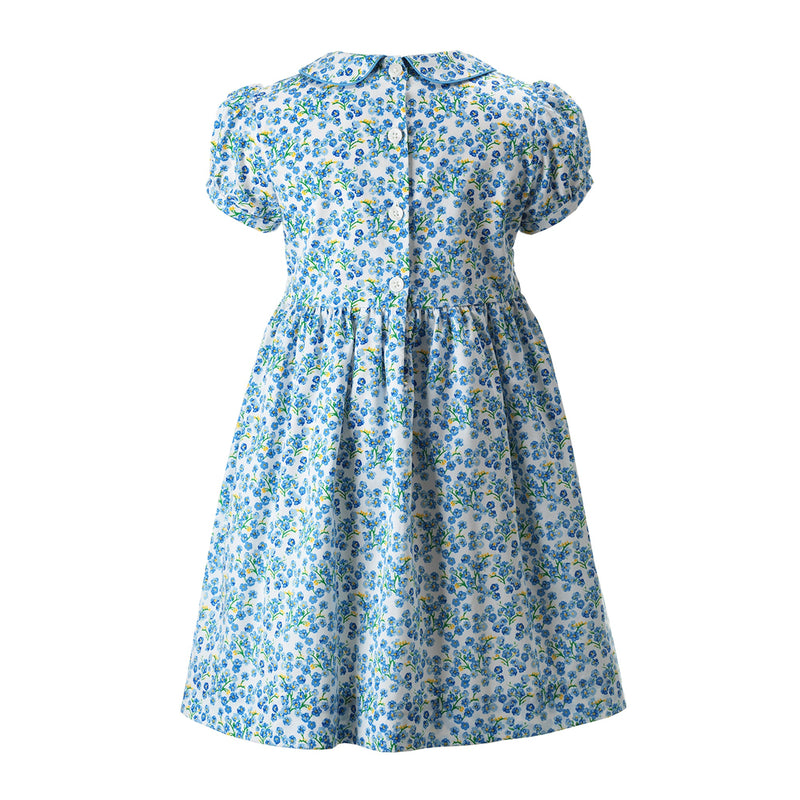 Girls blue floral dress with hand-smocked bodice, peter pan collar and gathered skirt.