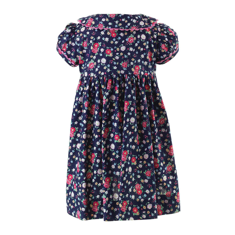 Babies navy button-front dress with floral print, puff sleeves and pink ricrac trims and buttons.