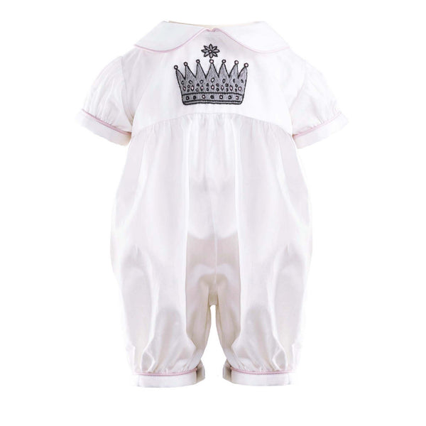 Ivory babysuit with crown embroidered motif on chest and pink piping at collar and cuffs.