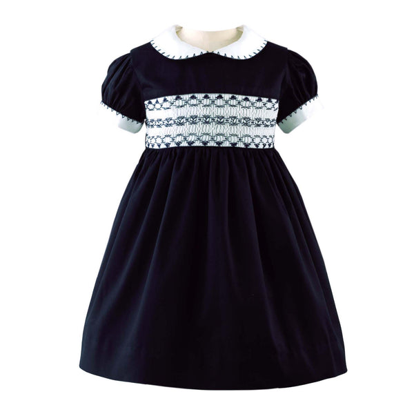 Babies navy smocked dress with ivory peter pan collar and short puff sleeves.