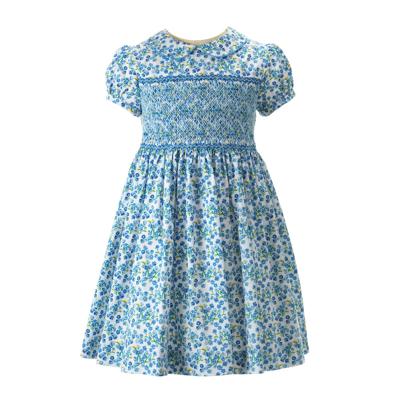 Girls blue floral dress with hand-smocked bodice, peter pan collar and gathered skirt.