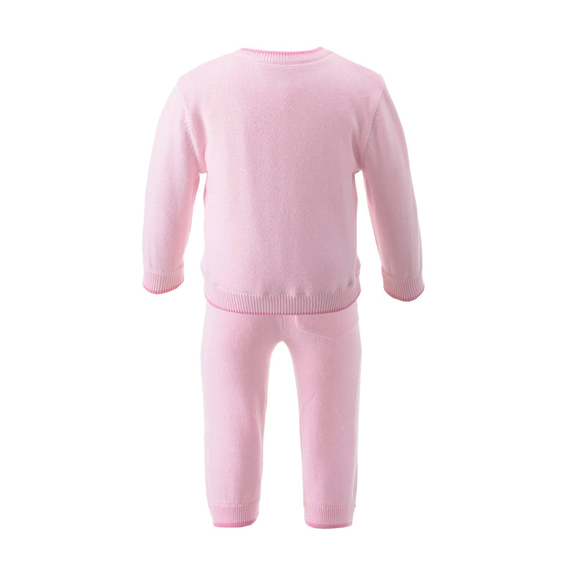 Baby knitted pink cardigan and trousers set with intarsia bow design on the chest area.