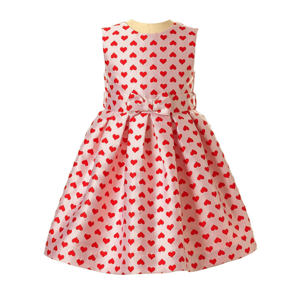 Girls pink damask party dress with bright red hearts and 3D bows at the front waist.
