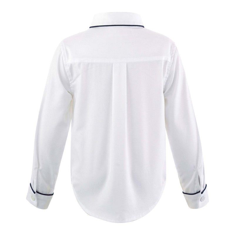 Boys white pique shirt, trimmed with navy pipping at collar edge, cufs and button placket.