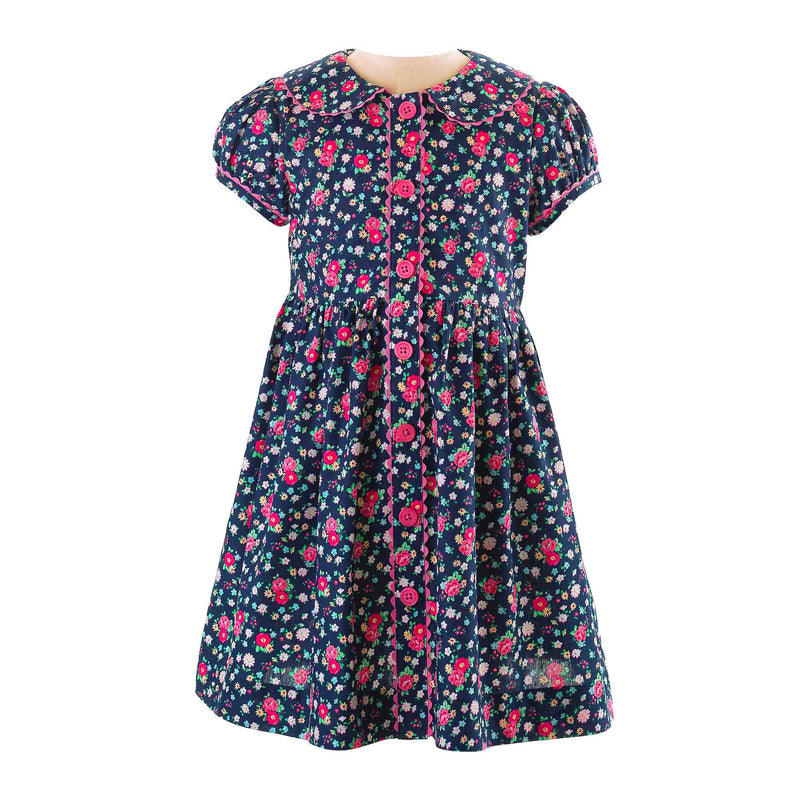 Girls navy button-front dress with floral print, puff sleeves and pink ricrac trims and buttons.