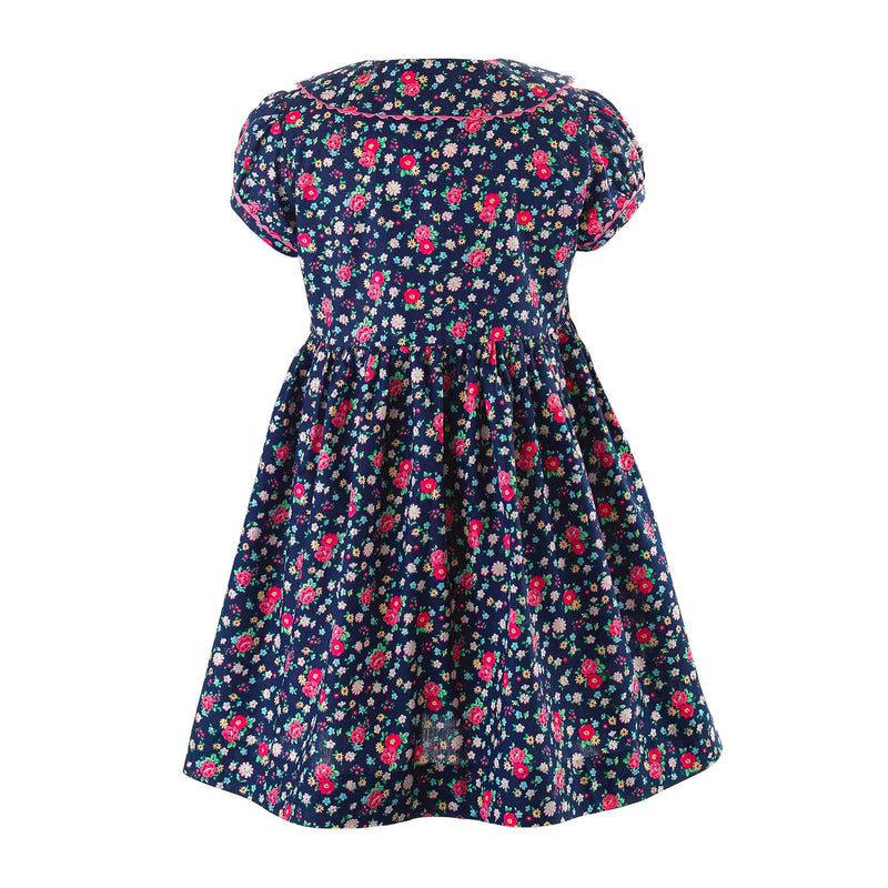 Girls navy button-front dress with floral print, puff sleeves and pink ricrac trims and buttons.