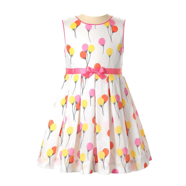 Girls sleeveless pleated dress with pink and yellow balloon print and pink ribbon and bow at the waist.