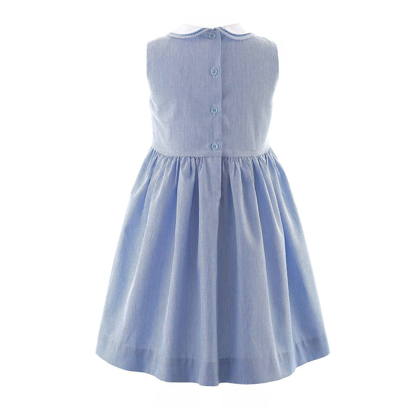 Girls sleeveless dress with blue and ivory stripes, hand-smocked sailboat design and peter pan collar.