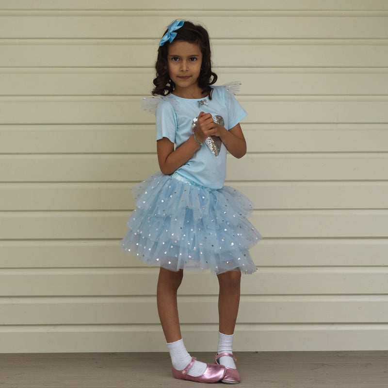 Girl in short sleeve tutu & top set decorated with silver heart and sequins and matching hairbow.