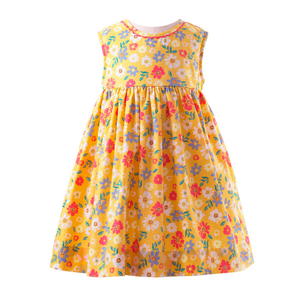 Babies cotton sleeveless dress in floral design on yellow background and gathered skirt.