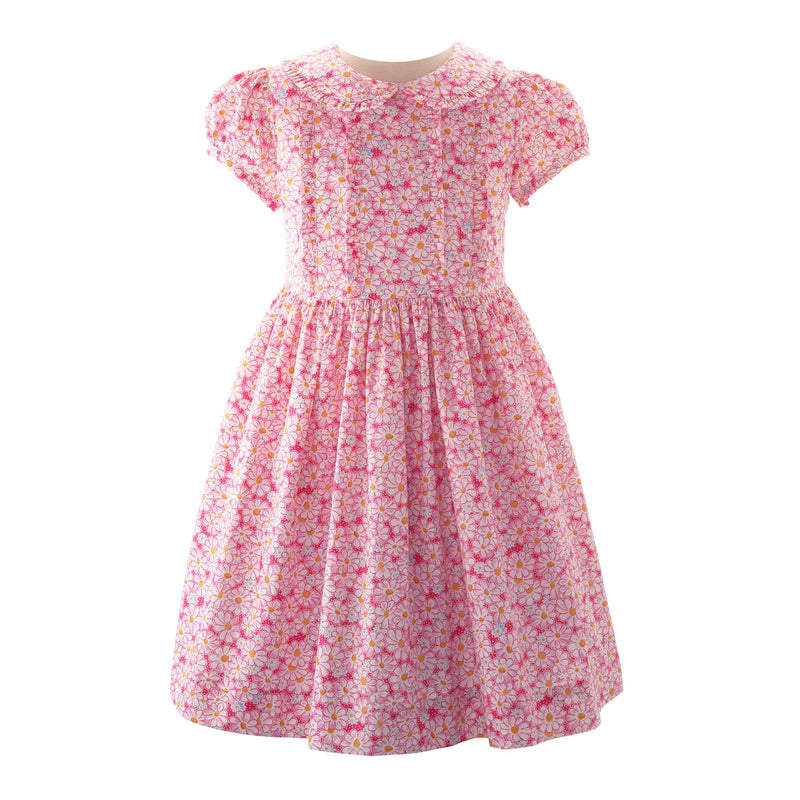 Girls pink floral print dress with frill on the bodice and collar, and puff sleeves.
