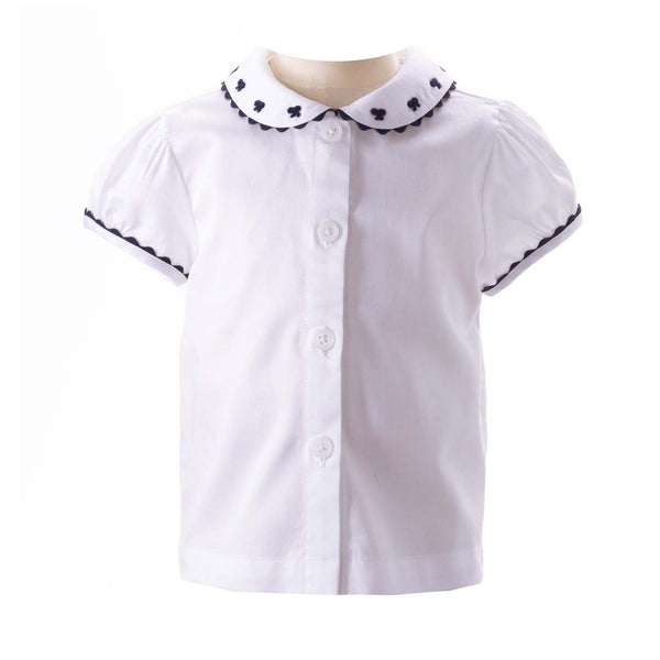 Baby white blouse with navy bow embroidered peter pan collar, trimmed with frills and navy pipping.