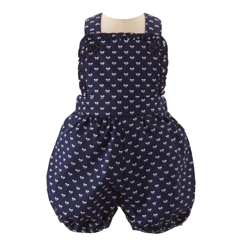 Baby girl navy dungarees, frill trimmed with white mini bow design.