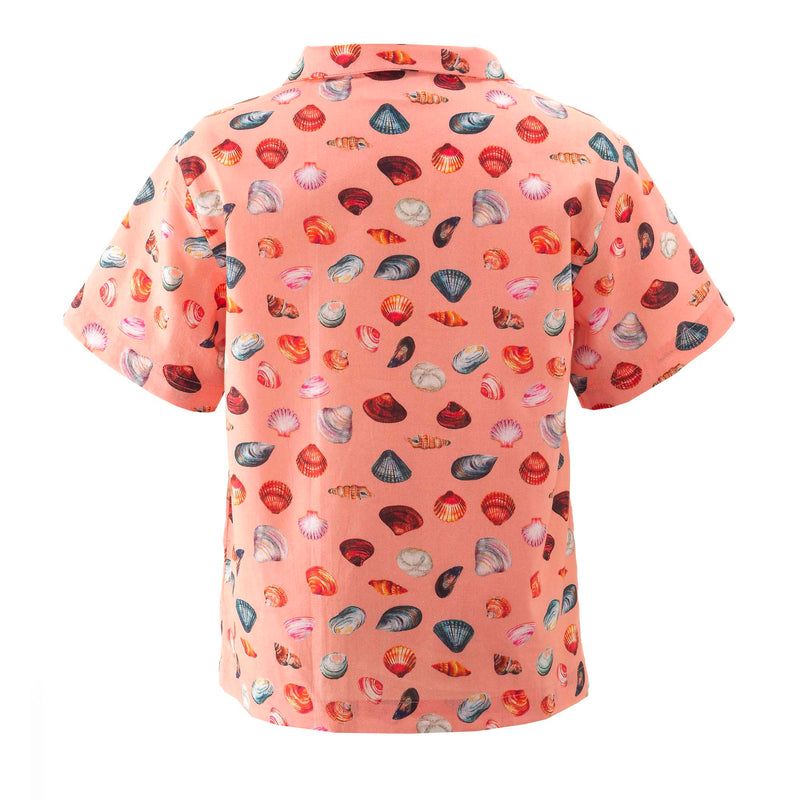 Boys open collar, short sleeved shirt with sandy beach print on peach base.