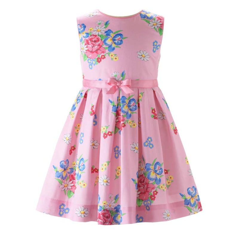Girls pleated sleeveless dress with bouquet print on pink base and pink ribbon and bow at waist.