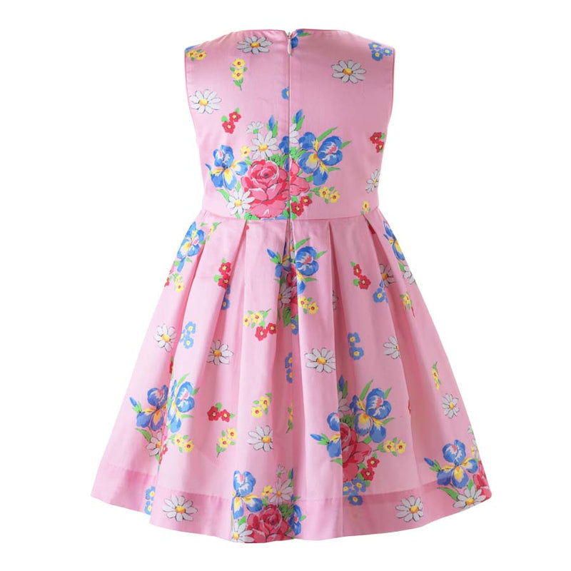 Girls pleated sleeveless dress with bouquet print on pink base and pink ribbon and bow at waist.