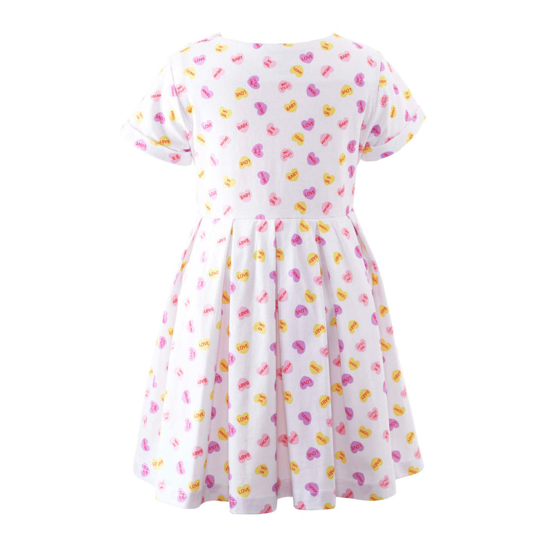 Girls soft cotton jersey dress with playful heart print on ivory base and pleated skirt.