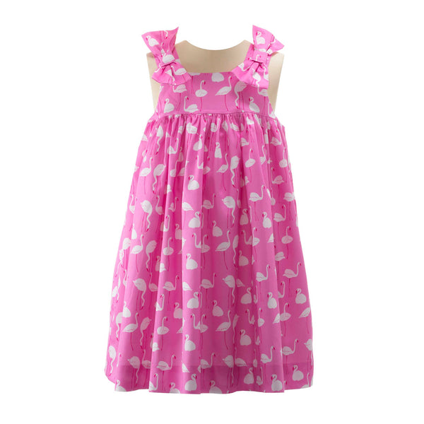 Girls pink sundress with flamingo print and 3D bows on straps.