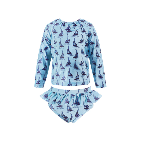 Girl two piece rash guard with long sleeves and frill bottom, with sailboat print on blue background