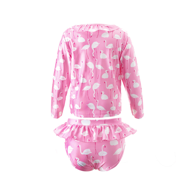 Girl two piece rash guard with long sleeves and frill bottom, with flamingo print on pink background