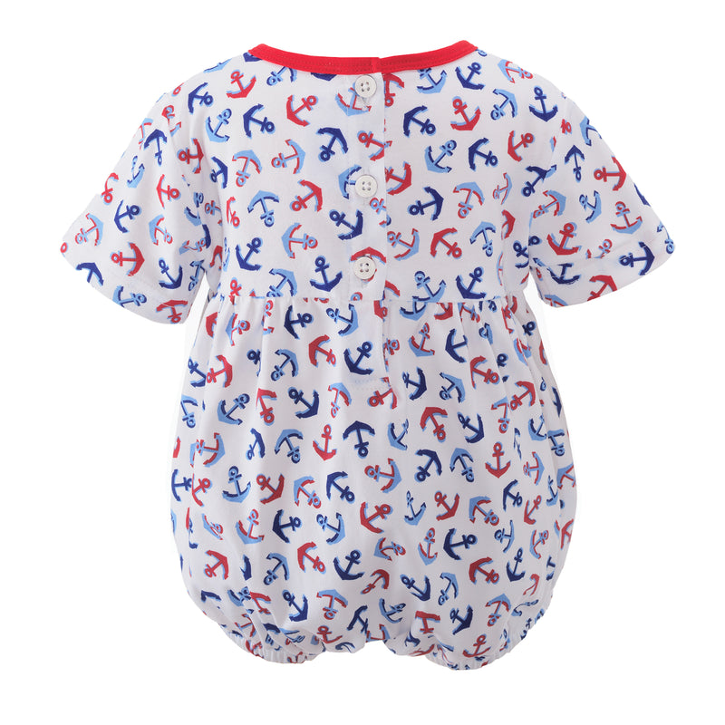 Unisex gathered babysuit with red and blue anchor print and red trimming at the neck and chest.