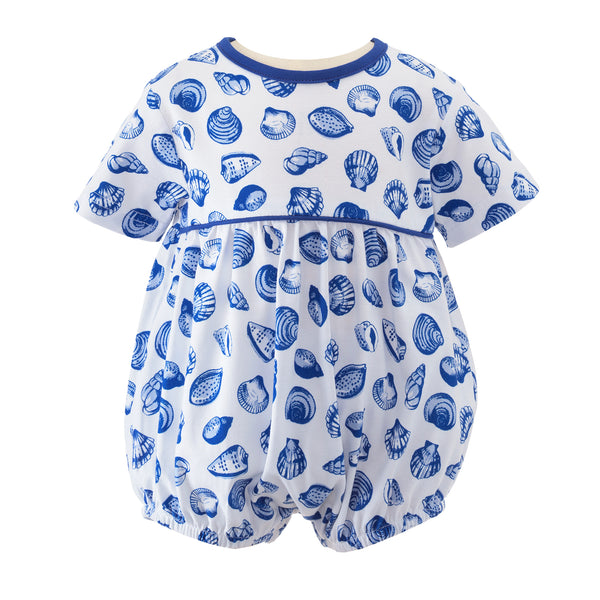 Ivory jersey babysuit in blue seashell print, and blue piping on neckline and across bodice