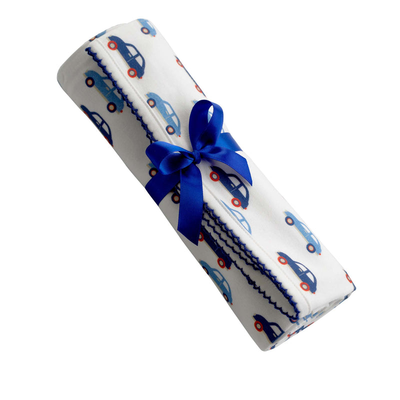 Soft cotton interlock blanket with blue toy car print on white base, with navy picot trim.