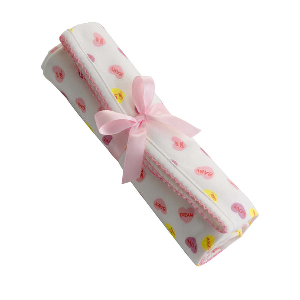 Soft cotton interlock blanket with pink and yellow heart print on ivory base, with pink picot trim.
