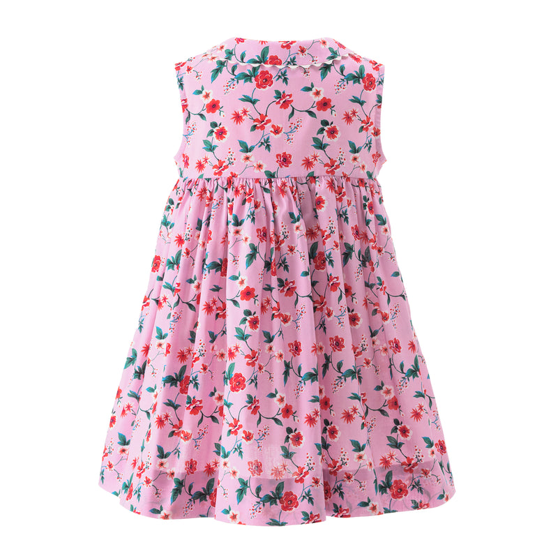 Babies pink sleeveless button-front dress with botanical print and pink ric rac trims and buttons.