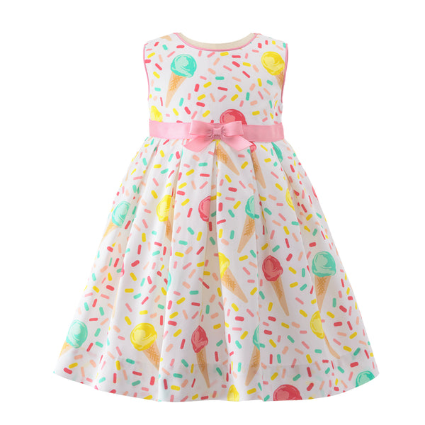 Babies ivory sleeveless pleated dress with ice cream cones print, pink piping and ribbon at waist.
