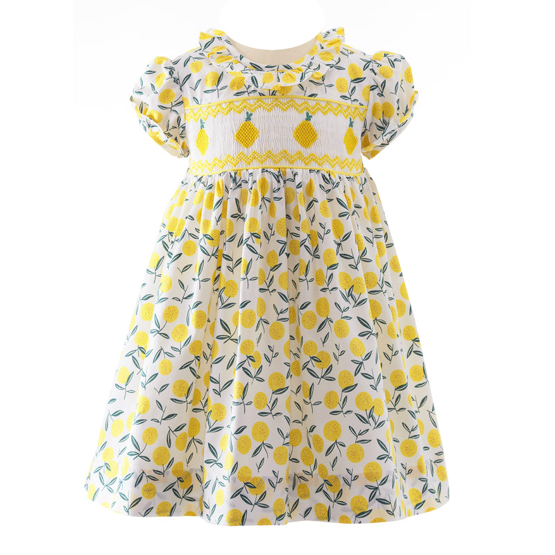Baby yellow floral dress with hand-smocked lemon design across bodice, frill trimmed collar and cuffs