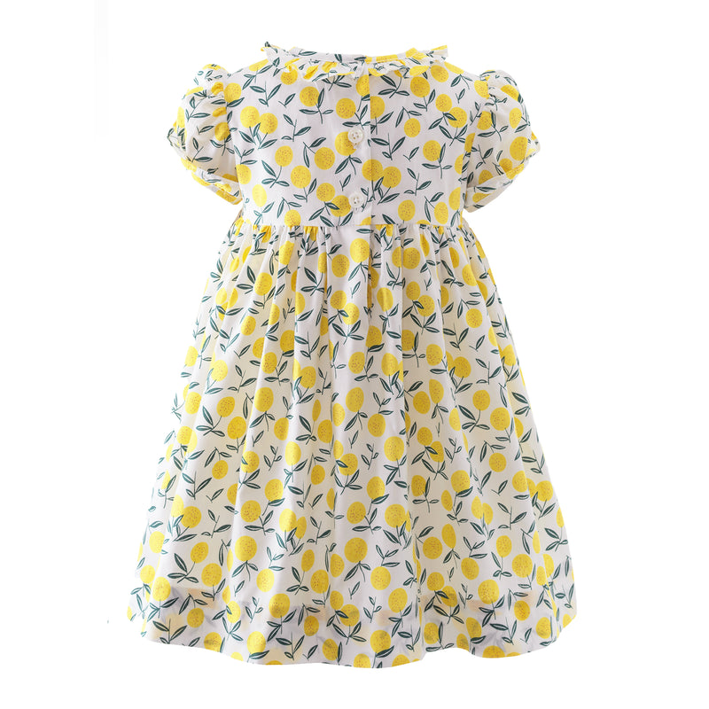 Baby yellow floral dress with hand-smocked lemon design across bodice, frill trimmed collar and cuffs