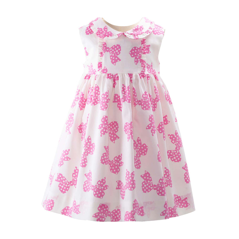 Baby girls sleeveless ivory dress with pink polka dot bow print, with frills at front and collar.