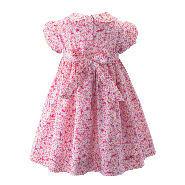 Babies pink floral print dress with frill on the bodice and collar, and puff sleeves.