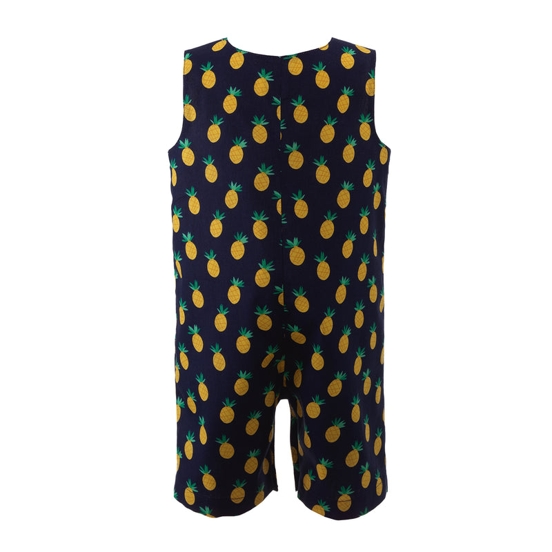 Baby boy navy dungarees with pineapple print, with button opening at shoulders and adjustable straps