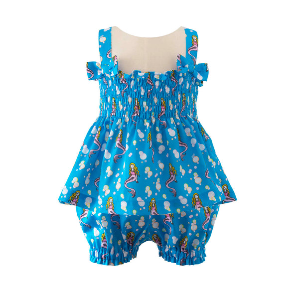 Babies ruched top with bows on straps and matching shorts with mermaid print on blue background.