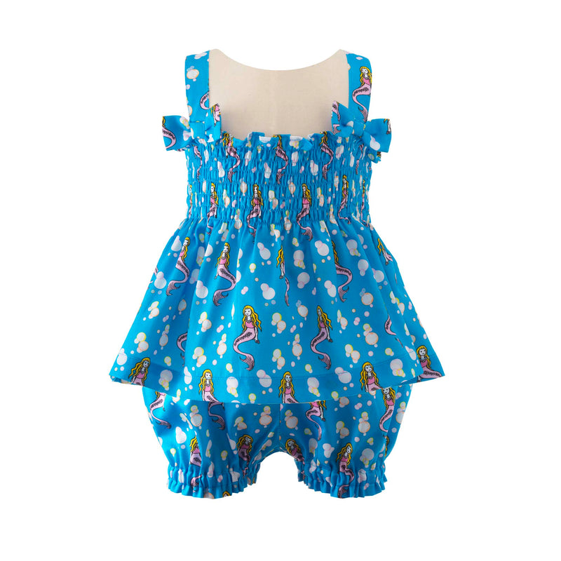 Babies ruched top with bows on straps and matching shorts with mermaid print on blue background.
