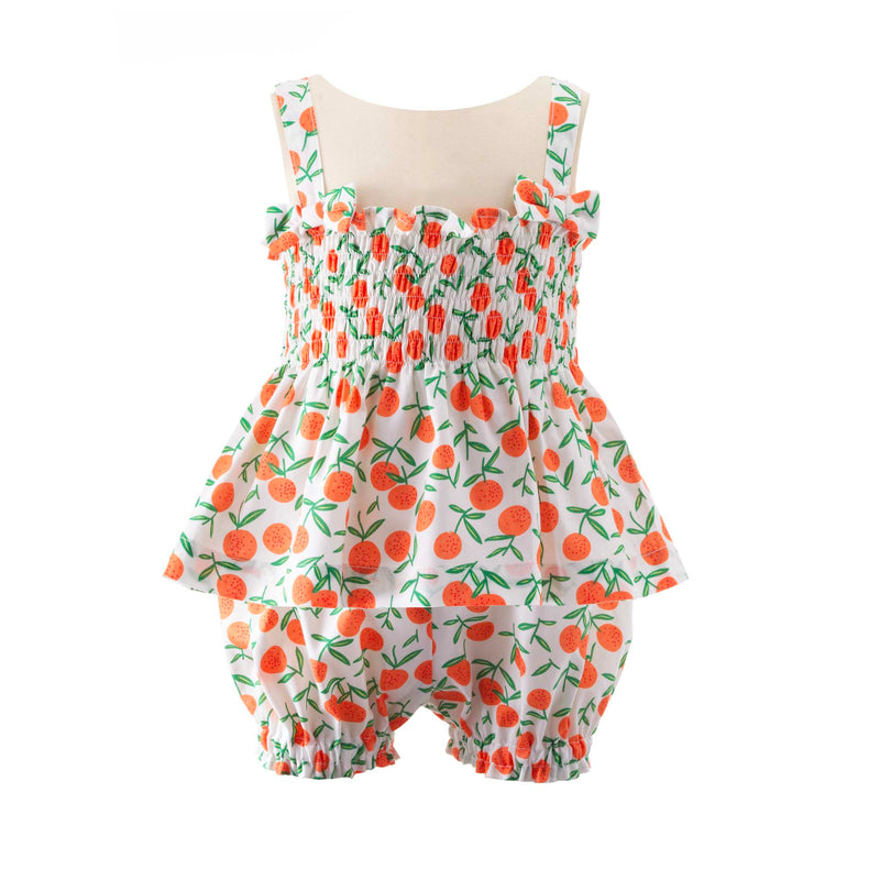 Babies ruched top with bows on straps and matching shorts with tangerine print on ivory background.