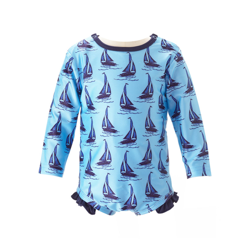 Baby blue one piece rash guard with sailboat print, long sleeves and frill at the leg.