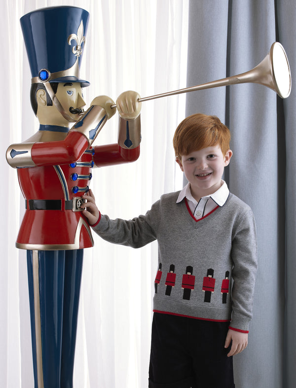 Boy wearing soldier v-neck sweater styled with navy corduroy shorts