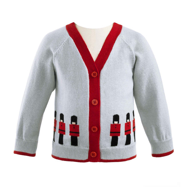 Baby grey soldier intarsia cardigan with red edging on cuffs and hem.