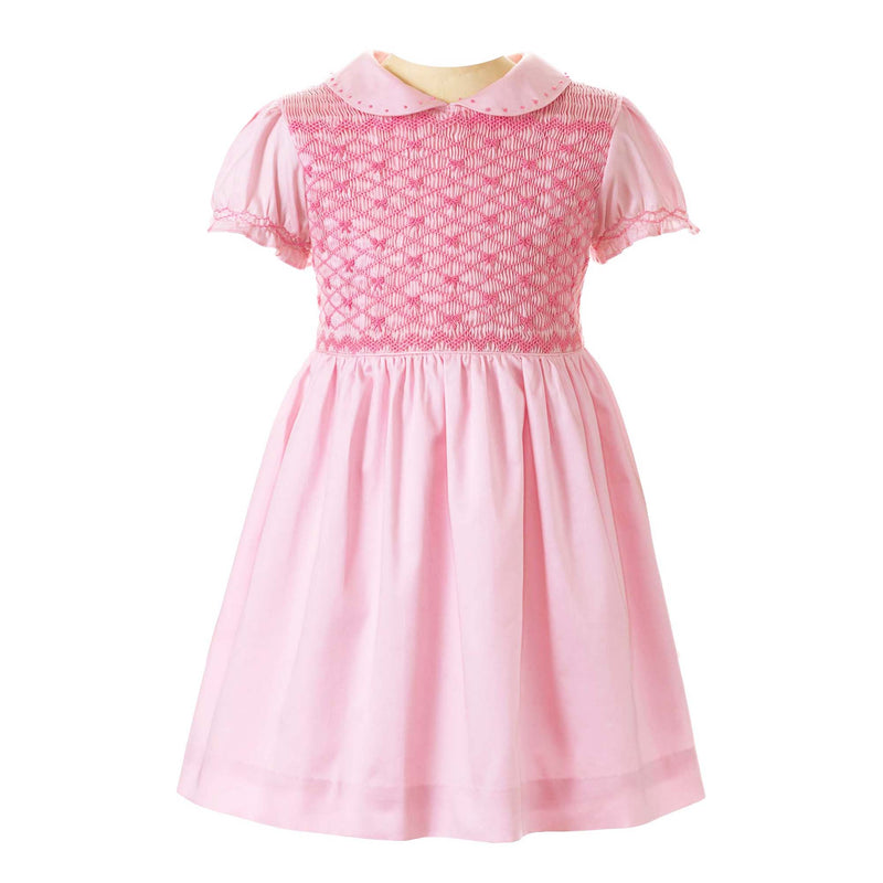 Girls pink dress with smocked bodice, embroidered with bows, peter pan collar and gathered skirt.
