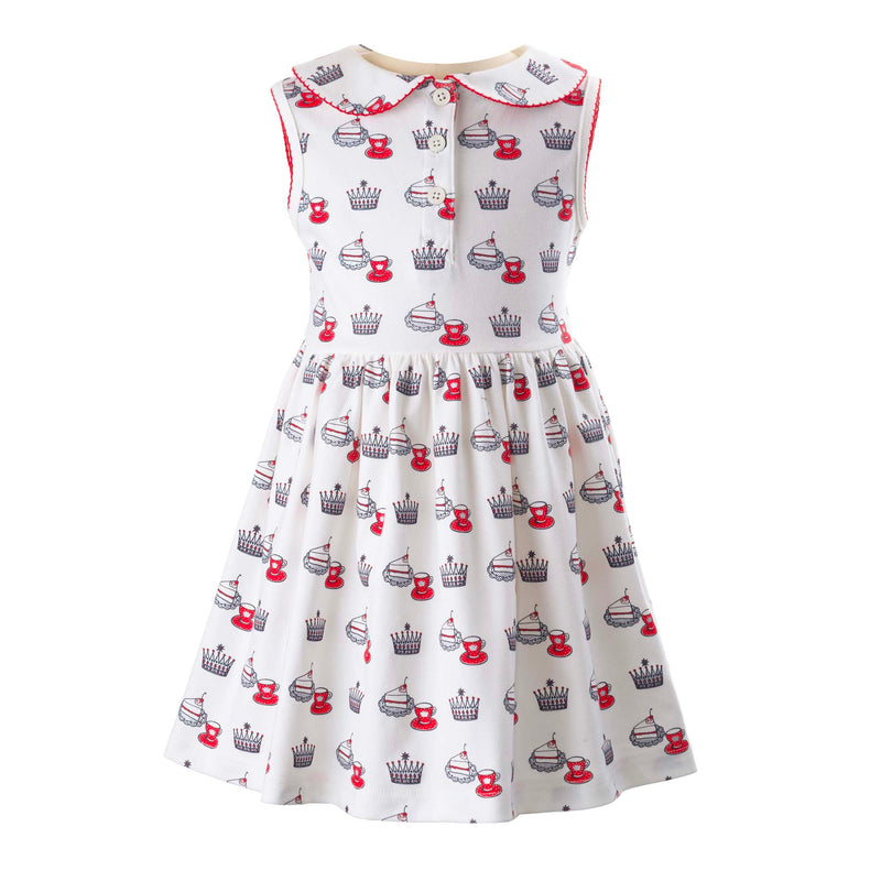 Girls ivory jersey dress with royal team party themed print, peter pan collar and half button placket.