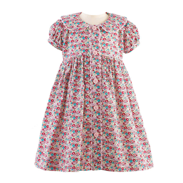 Babies ditsy floral button-front dress with puff sleeves, coordinating ricrac trims and buttons.