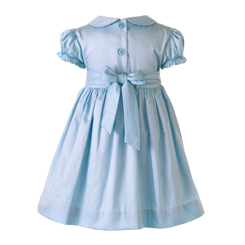 Babies blue dress with smocked bodice, embroidered with roses, peter pan collar and gathered skirt.