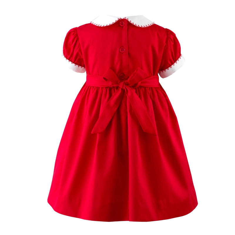 Babies red smocked dress with ivory peter pan collar and short puff sleeves.