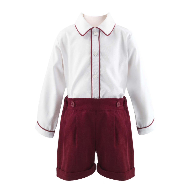 Baby set comprising of a classic white shirt with burgundy piping detail and burgundy babycord turn up shorts.