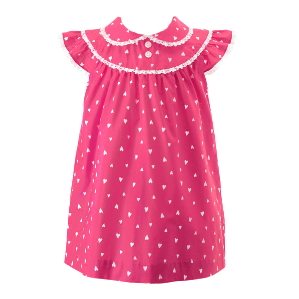 Girls pink gathered dress with white hearts print, peter pan collar and frills at neck and shoulders